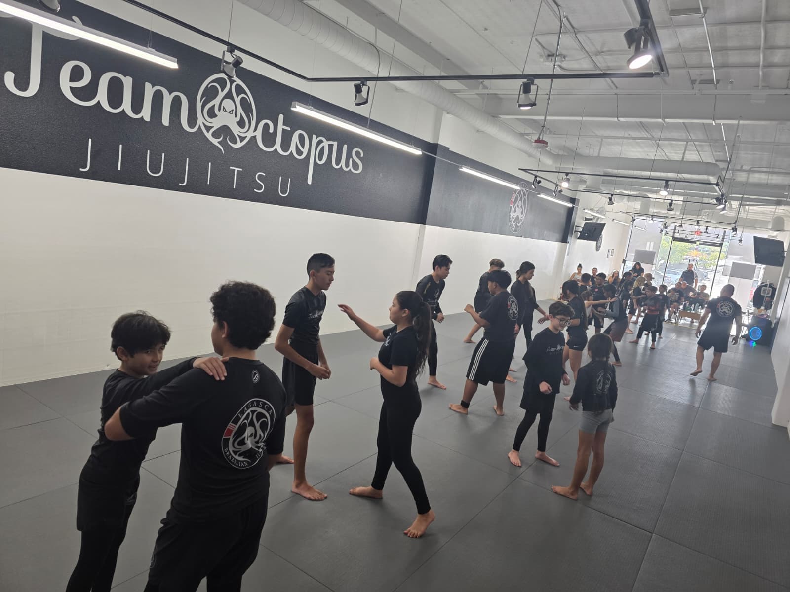 Team Octopus instructors and students gathered on the mats